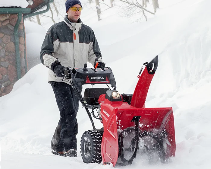 Honda Awd Series Two Stage Snow Blower Hss724Aawd Man Clearing Snow product image