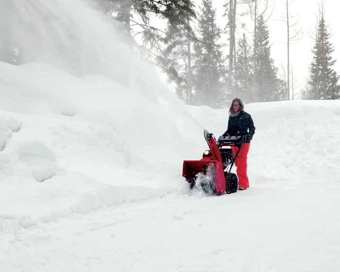 Honda Awd Series Two Stage Snow Blower Hss724Aawd Man Clearing Snow Distant product image