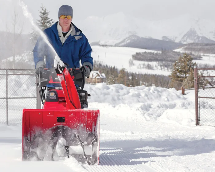 Honda Awd Series Two Stage Snow Blower Hss928Aawd Man Clearing Snow product image