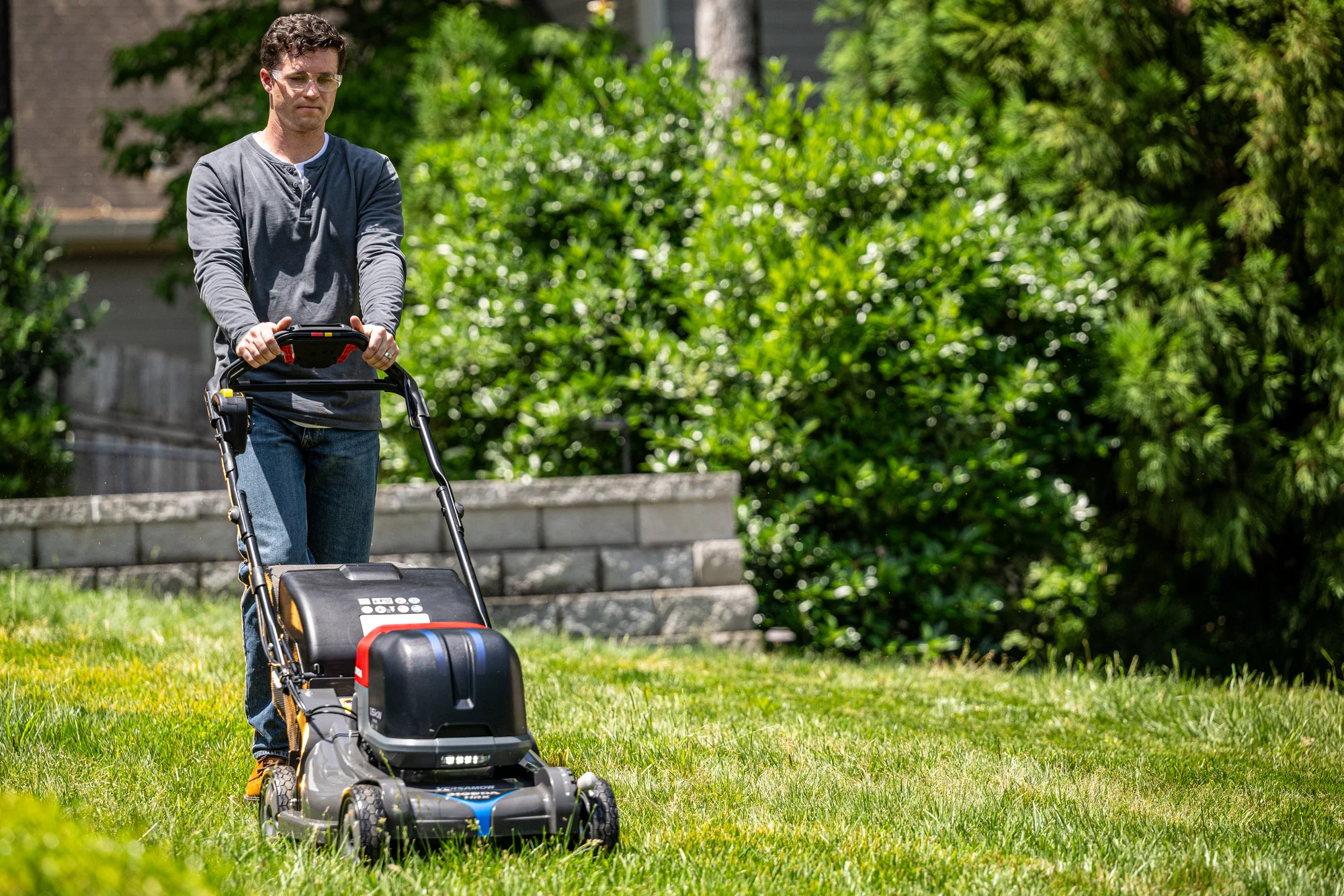 Honda Hrx Bv Battery Powered Walk Behind Lawn Mower Front View Left Man Cutting Lawn product image