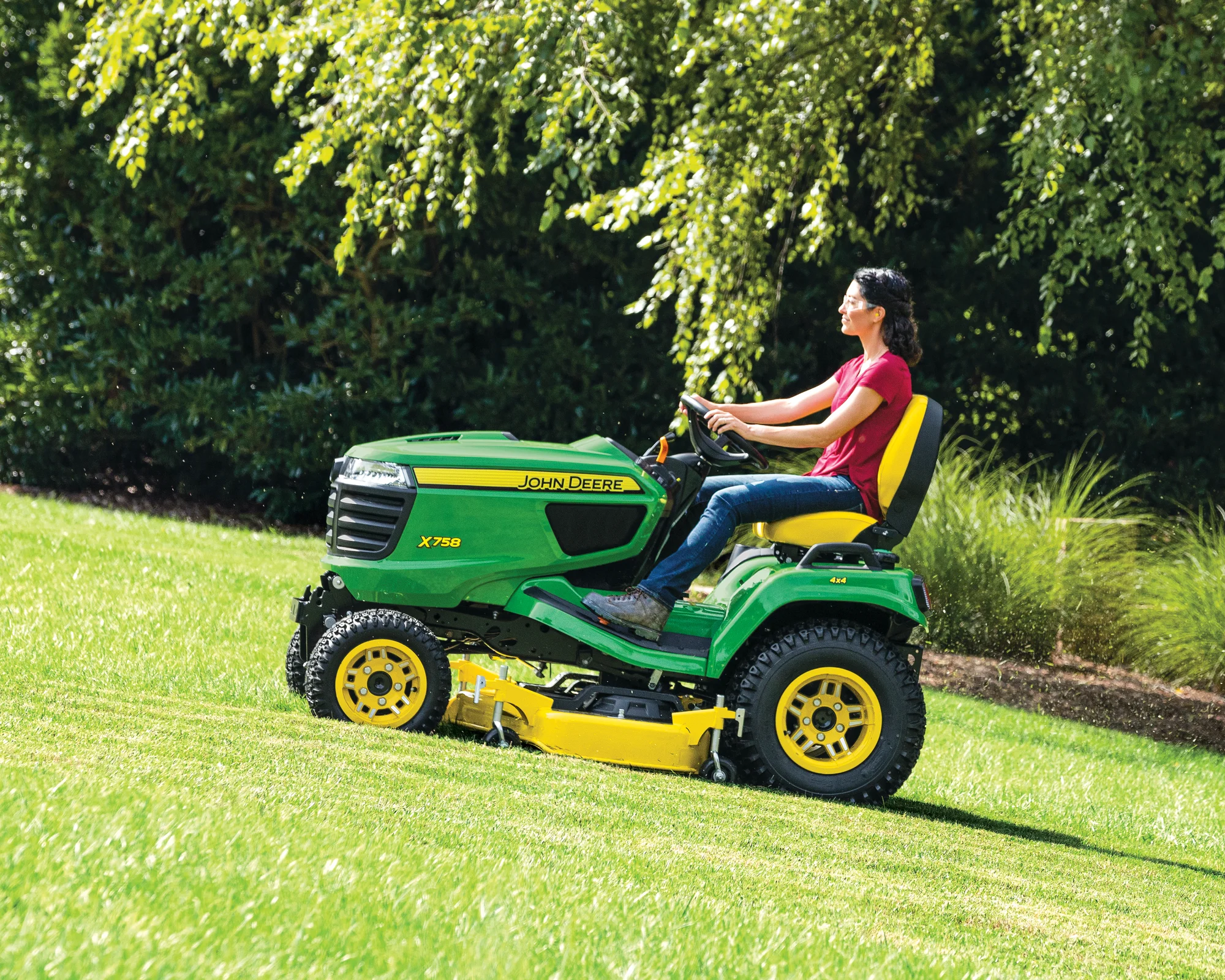 John Deere Signature X700 Series Garden Tractor X758 John Deere Signature X700 Series Garden Tractor X758 Side View Right Woman Cutting Grass product image
