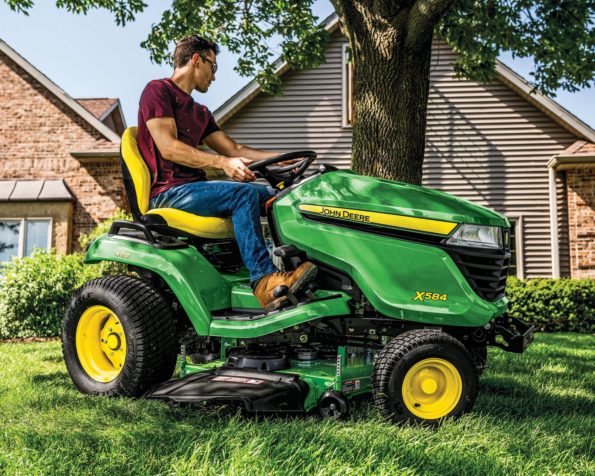 John Deere Select X500 Series Garden Tractor X584 John Deere X500 Select Series Lawn Tractor X584 Man Mowing product image