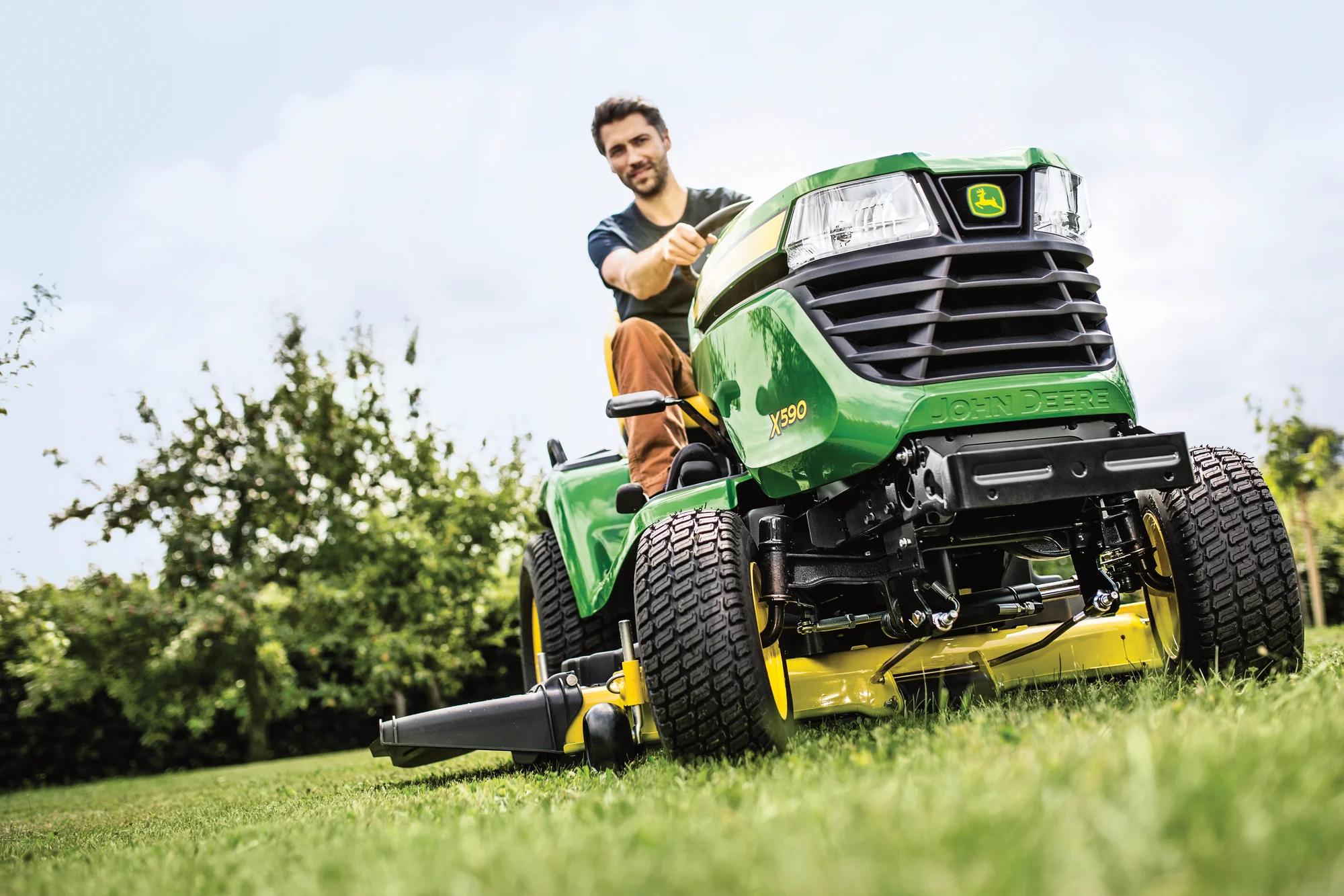 John Deere Select Series X500 Lawn Tractor X590 48 John Deere X500 Select Series Lawn Tractor X590 Man Mowing Close Up Tire product image