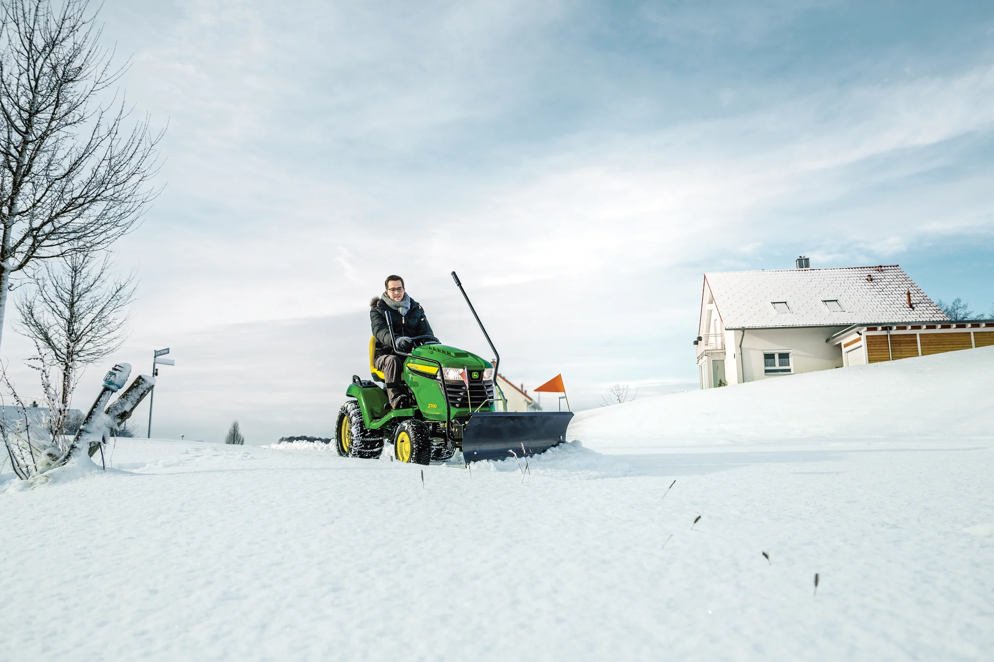 John Deere Select X500 Series Garden Tractor X590 John Deere X500 Select Series Lawn Tractor X590 Man With Snow And Snow Blade Attachment product image
