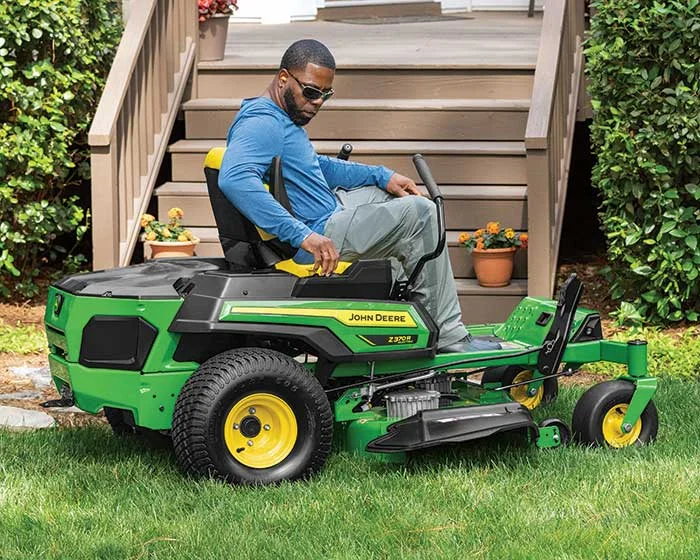 John Deere ZTrak 300 Electric Series Zero Turn Rider Z370R-42 Electric John Deere Ztrak 300 Electric Series Zero Turn Rider Z370R 42 Electric Man Adjusting Controls product image