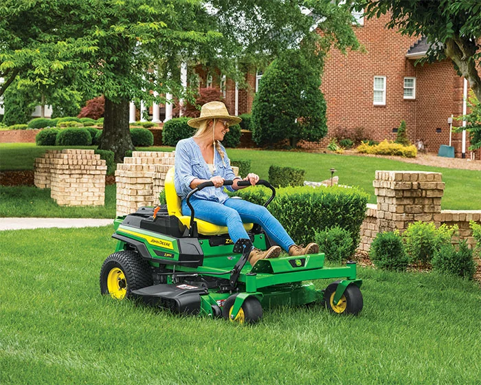 John Deere ZTrak 300 Series Zero Turn Rider Z315E John Deere Ztrak 300 Series Zero Turn Rider Z315E Woman Cutting Grass product image