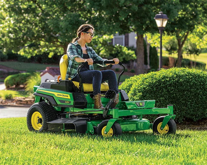 John Deere ZTrak 300 Series Zero Turn Rider Z315E John Deere Ztrak 300 Series Zero Turn Rider Z315E Woman On Mower product image