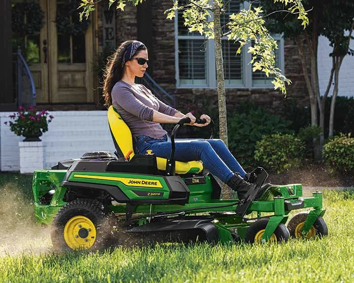 John Deere Ztrak 300 Series Zero Turn Rider Z320M Front Woman Cutting Grass product image