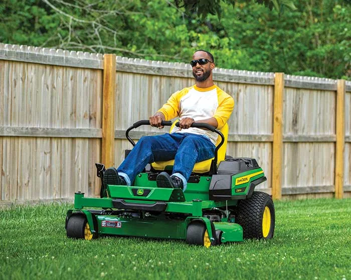 John Deere ZTrak 300 Series Zero Turn Rider Z320M John Deere Ztrak 300 Series Zero Turn Rider Z320M Man On Mower product image