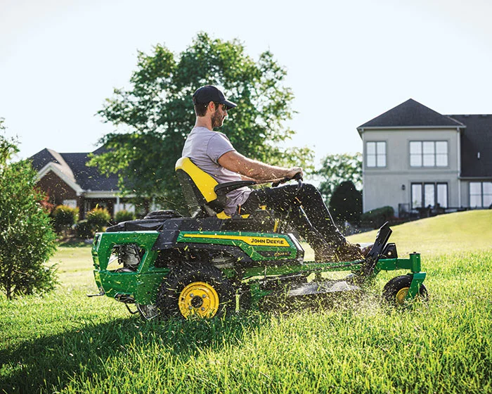 John Deere ZTrak 300 Series Zero Turn Rider Z320R John Deere Ztrak 300 Series Zero Turn Rider Z320R Man Cutting Grass product image