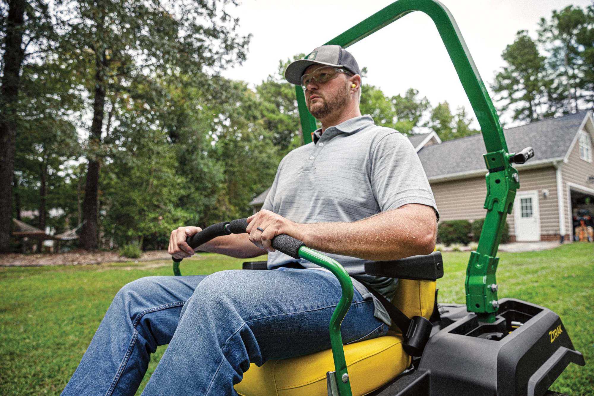John Deere Ztrak 500 Series Zero Turn Rider Z530M Man Sitting On Mower Closeup product image