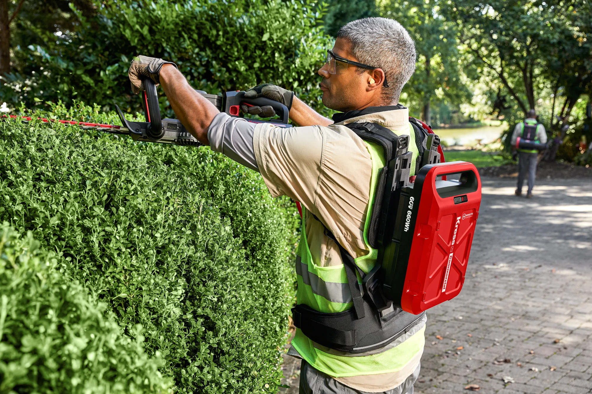 Kress Hedge Trimmer Man Trimming Top Bush