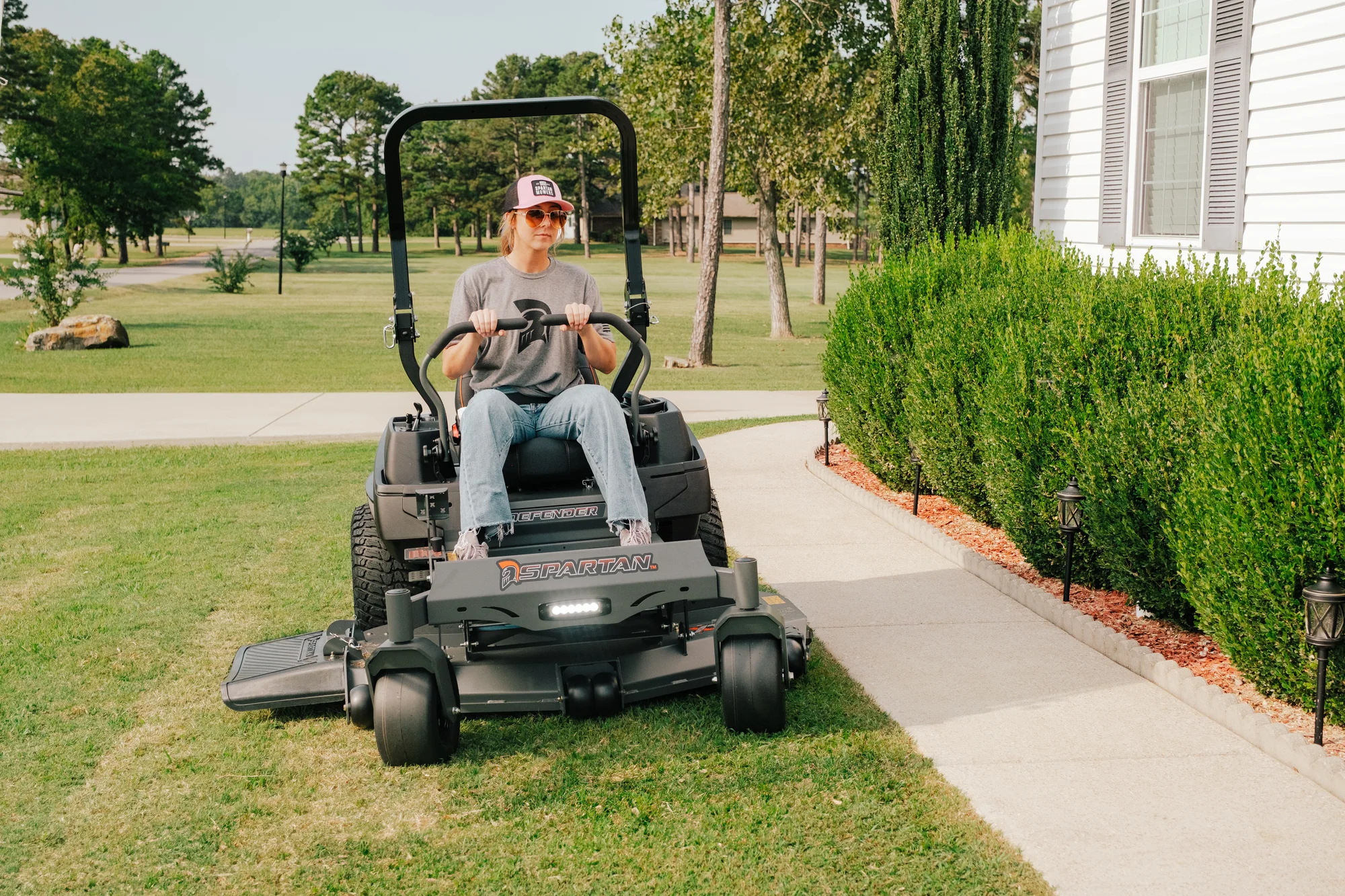 Spartan Defender Zero Turn Rider Szde1K48691Kr Woman On Mower Front View product image
