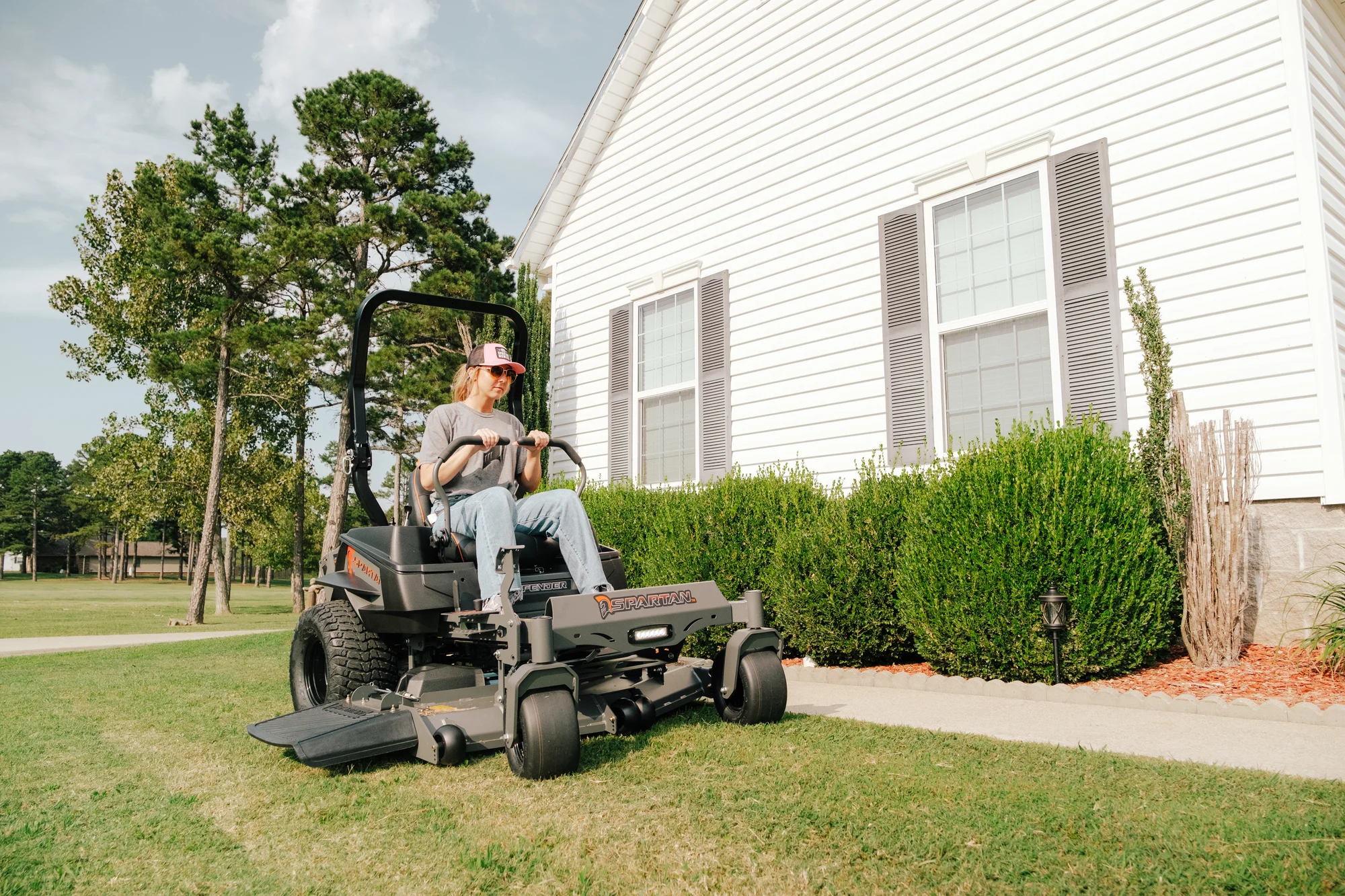 Spartan Defender Zero Turn Rider Szde1K54691Kr Wide Angle Woman On Mower product image