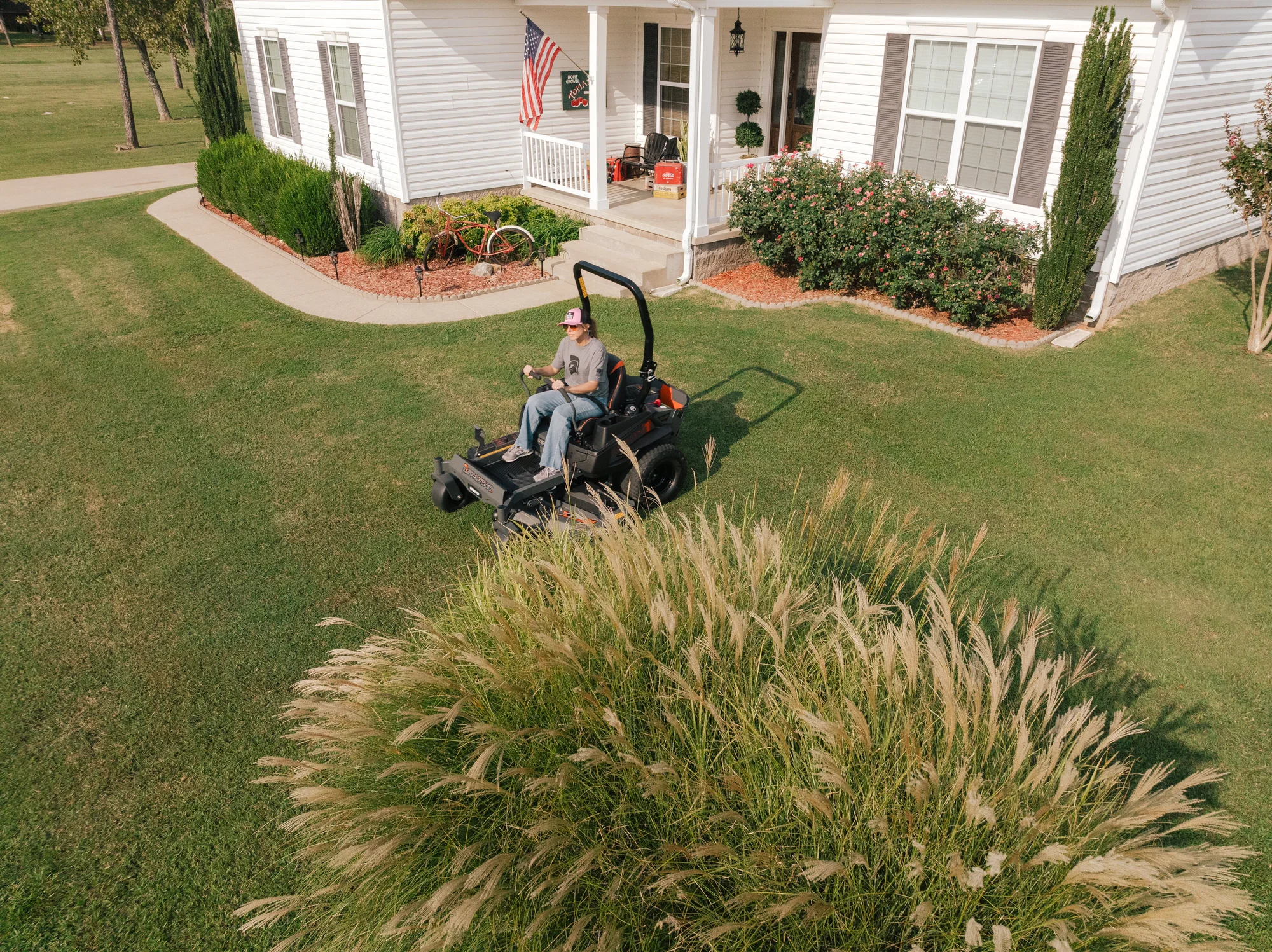 Spartan Defender Zero Turn Rider SZDE1K60730KR Spartan Defender Zero Turn Rider Szde1K60730Kr Woman On Mower Overhead product image