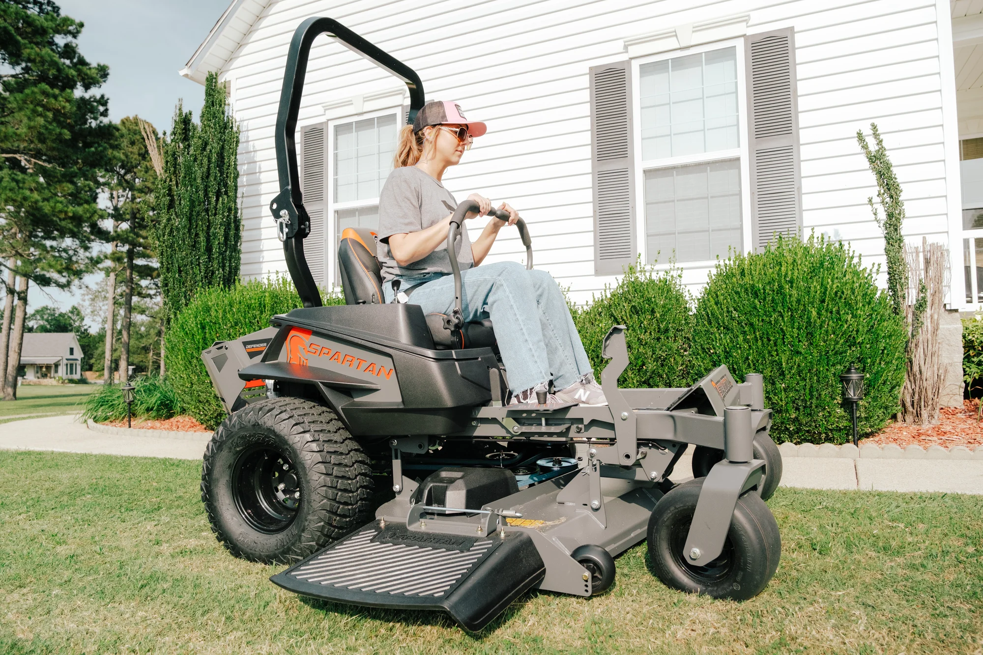 Spartan Defender Zero Turn Rider Szde1K60730Kr Woman On Mower Side View product image