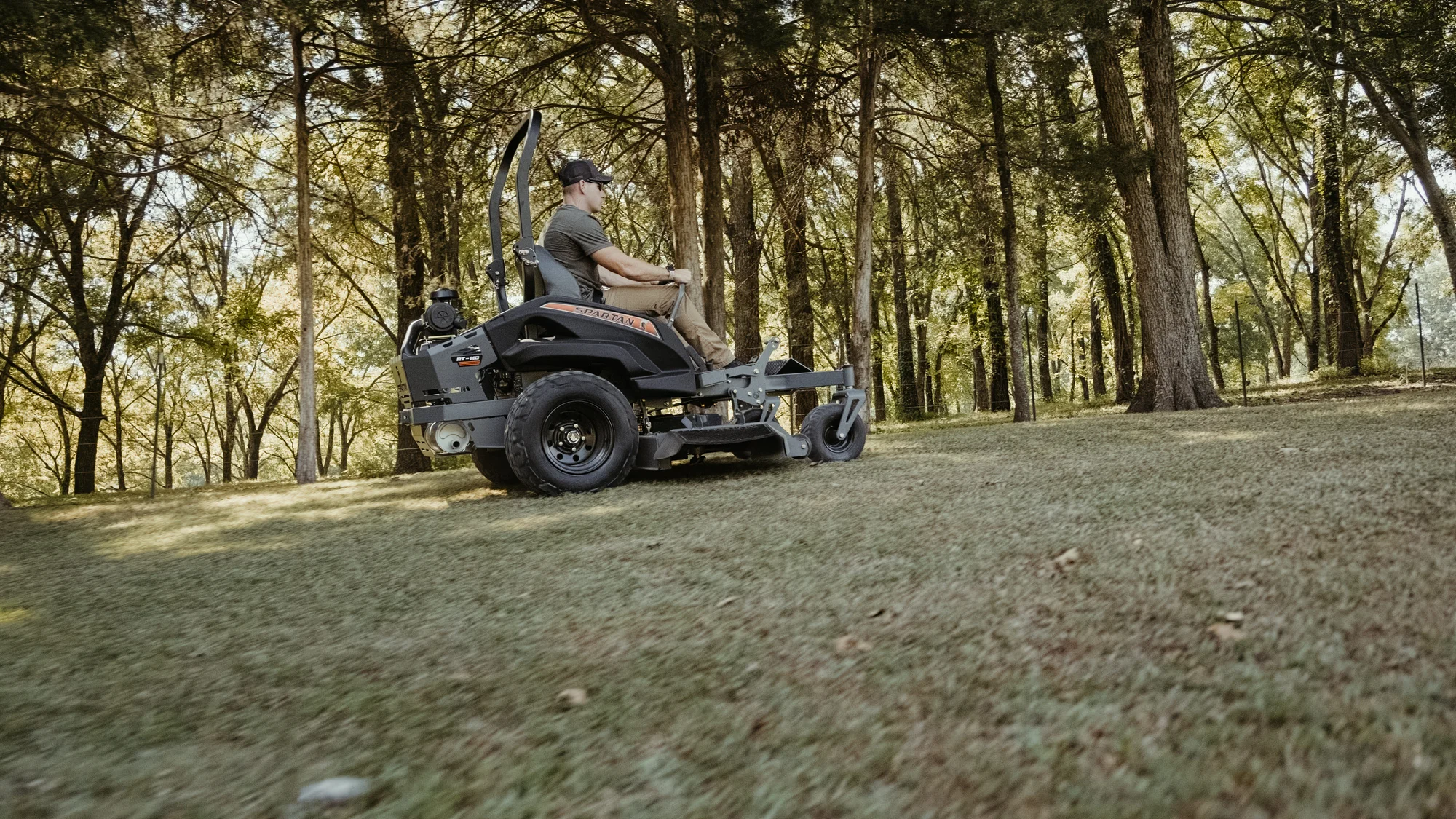 Spartan RT-HD Zero Turn Rider RSRHD154999KX Spartan Rt Hd Zero Turn Rider Rsrhd154999Kx Side View Left Man Cutting Grass product image