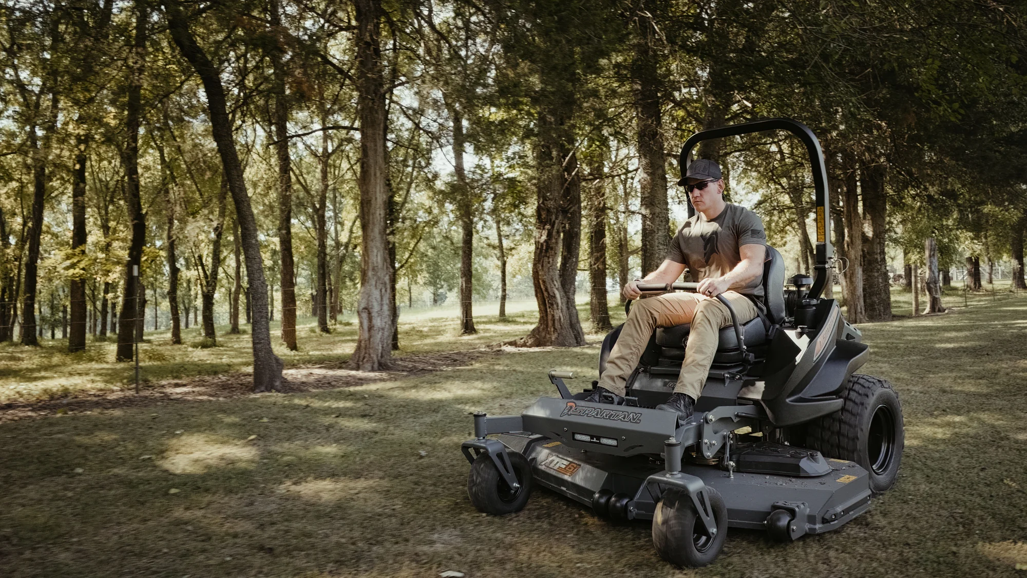 Spartan Rt Hd Zero Turn Rider Rsrhd161999Kx Front View Right Man Cutting Grass product image