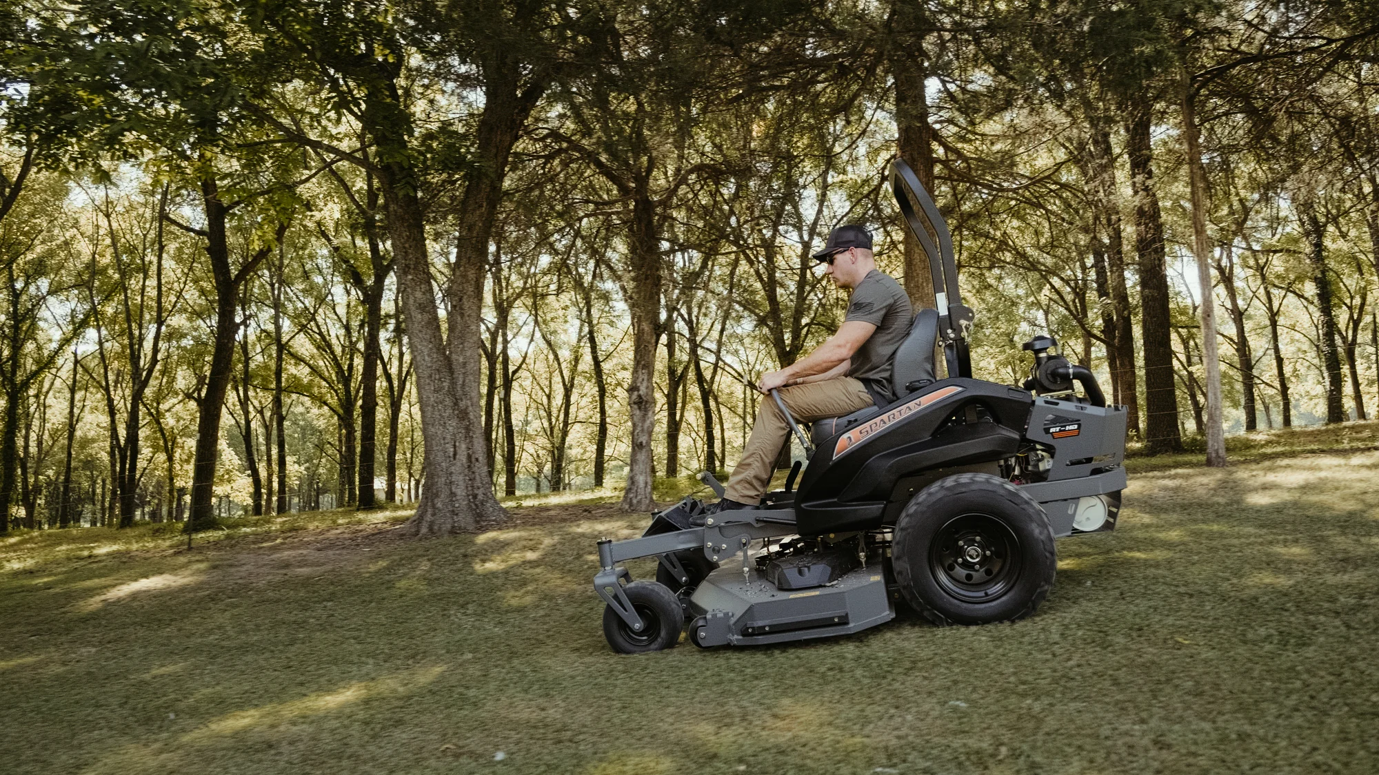 Spartan RT-HD Zero Turn Rider RSRHD161999KX Spartan Rt Hd Zero Turn Rider Rsrhd161999Kx Side View Right Man Cutting Grass product image
