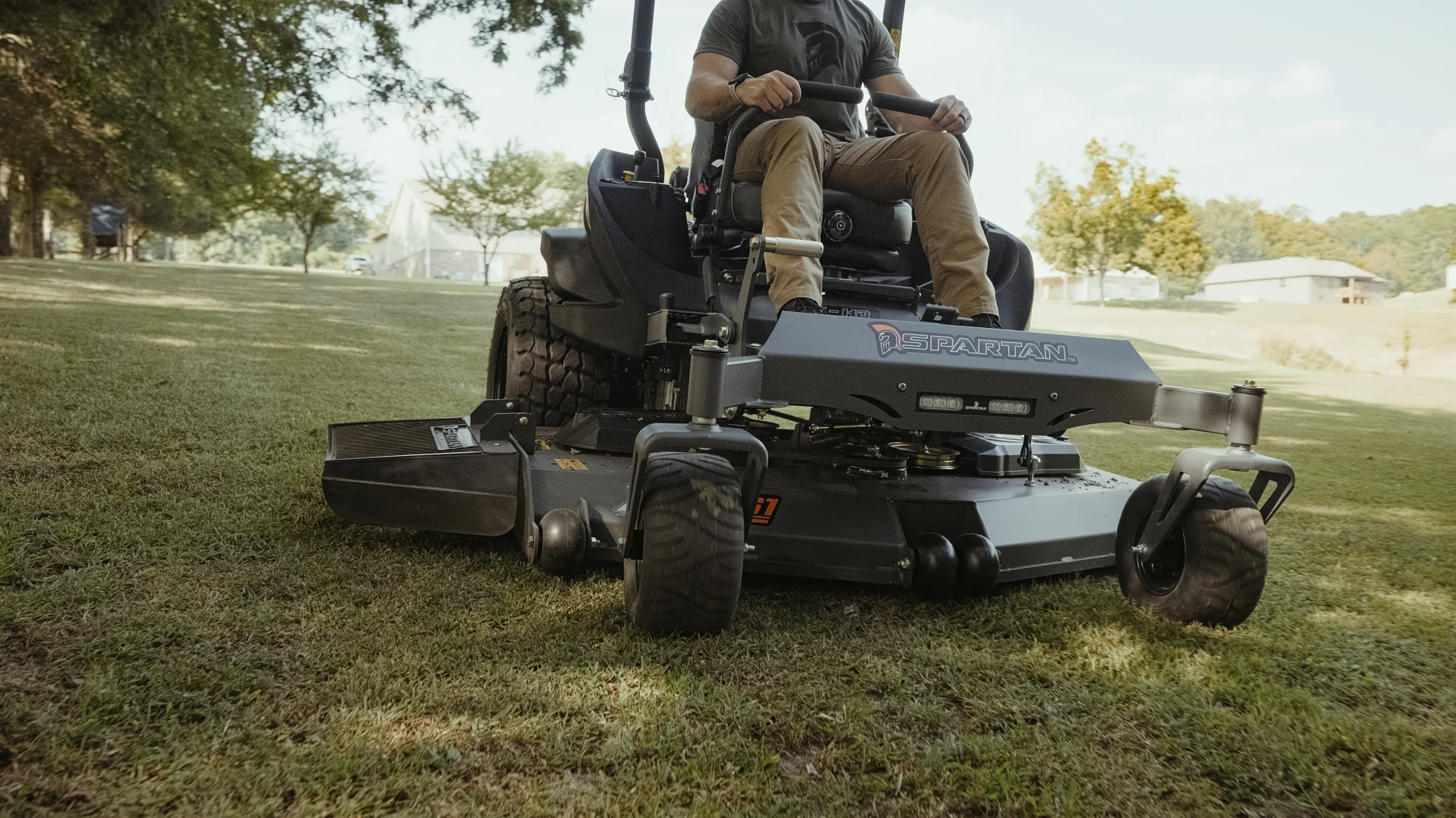 Spartan Rt Hd Zero Turn Rider Rsrhd172999Kx Front View Left Closeup Man Cutting Grass product image