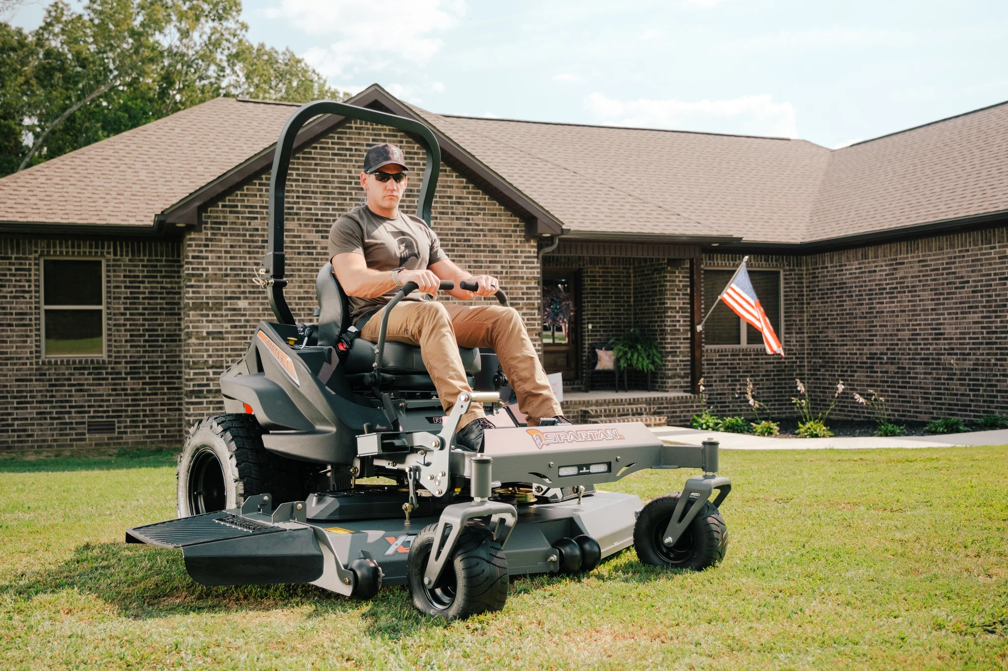Spartan Rt Hd Zero Turn Rider Rsrhd172999Kx Front View Left Man On Grass Residential product image