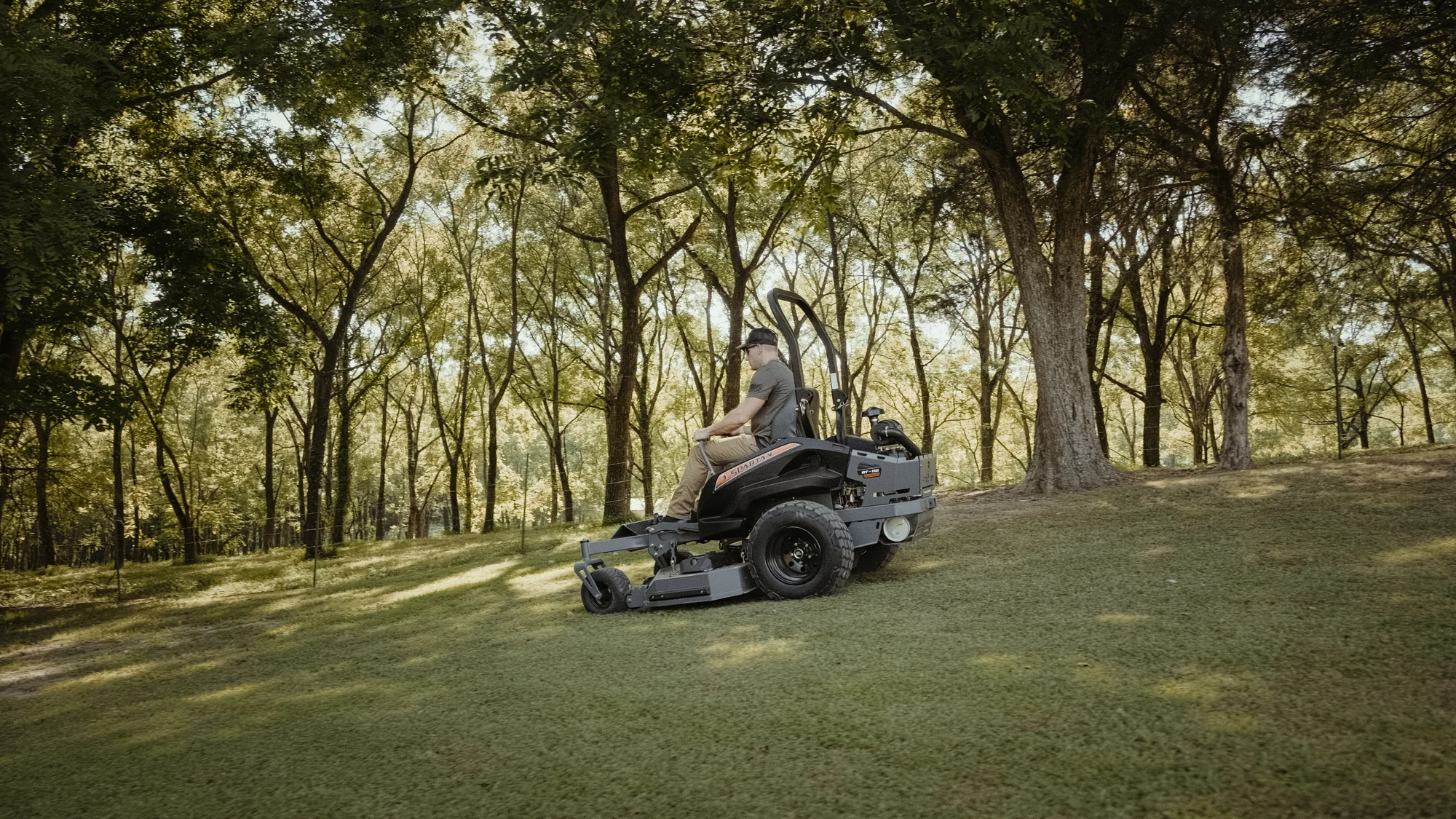 Spartan RT-HD Zero Turn Rider RSRHD172999KX Spartan Rt Hd Zero Turn Rider Rsrhd172999Kx Side View Right Wide Man Cutting Lawn product image