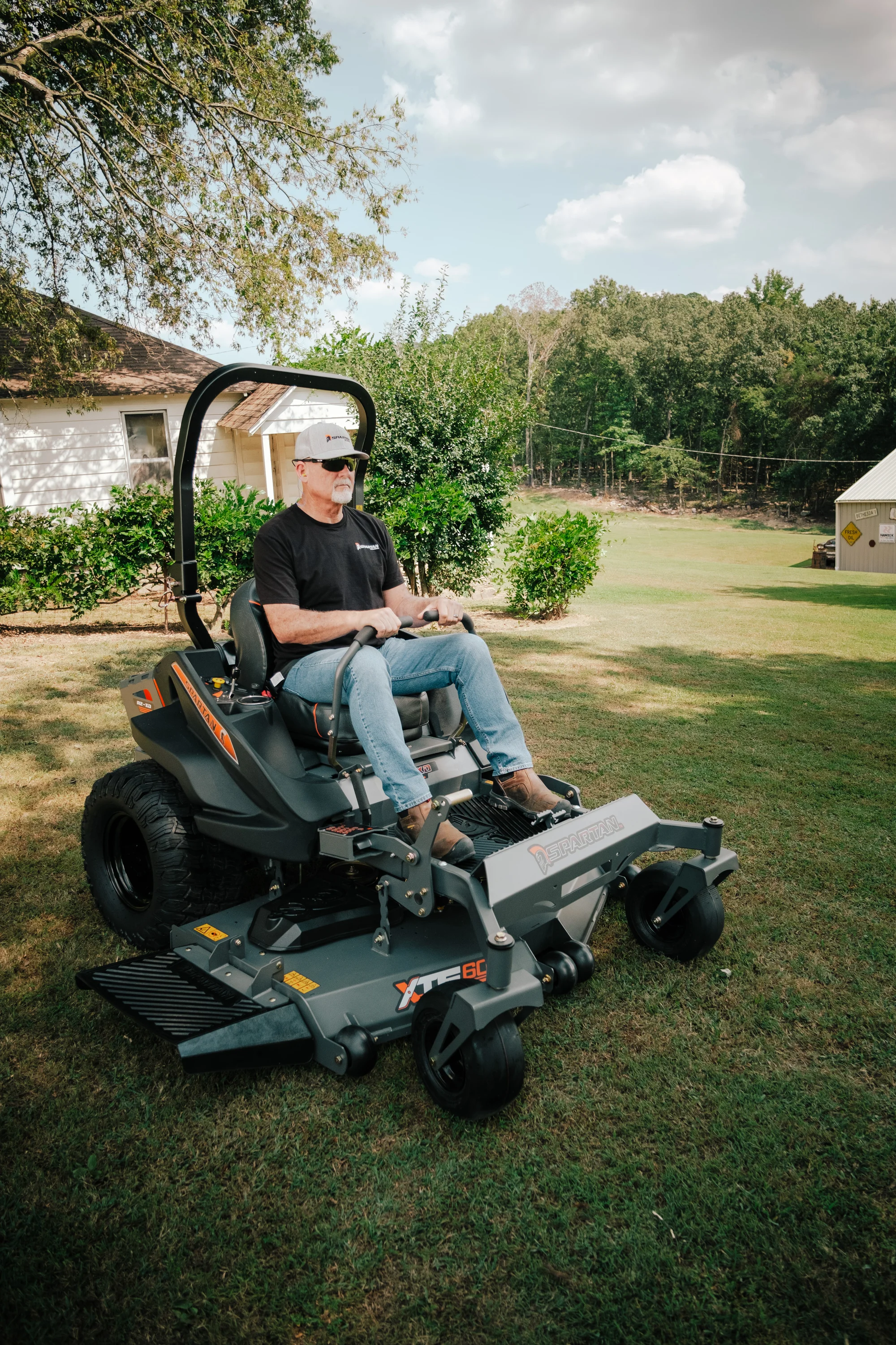 Spartan Rz Xd Zero Turn Rider Rszl2148Fx730 Man Cutting Grass product image