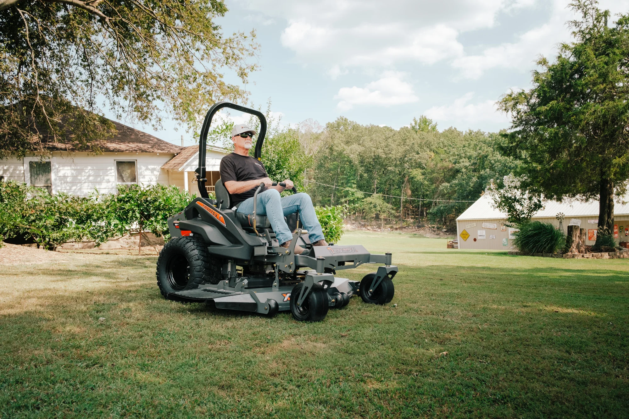 Spartan Rz Xd Zero Turn Rider Rszl2148Fx730 Wide Angle Man Posing Mower product image