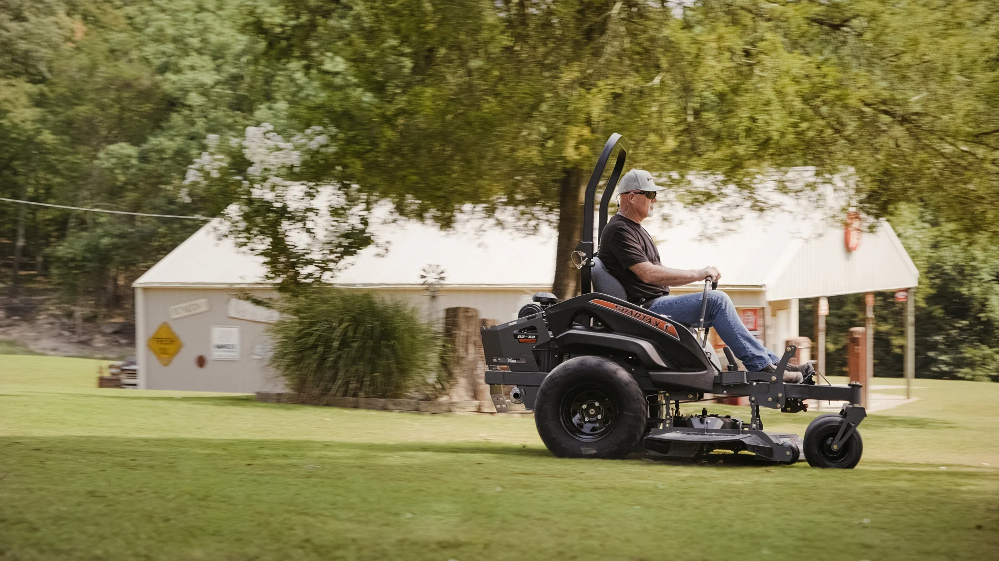 Spartan RZ-XD Zero Turn Rider RSZL2154FX730 Spartan Rz Xd Zero Turn Rider Rszl2154Fx730 Man Cutting Grass Side View product image