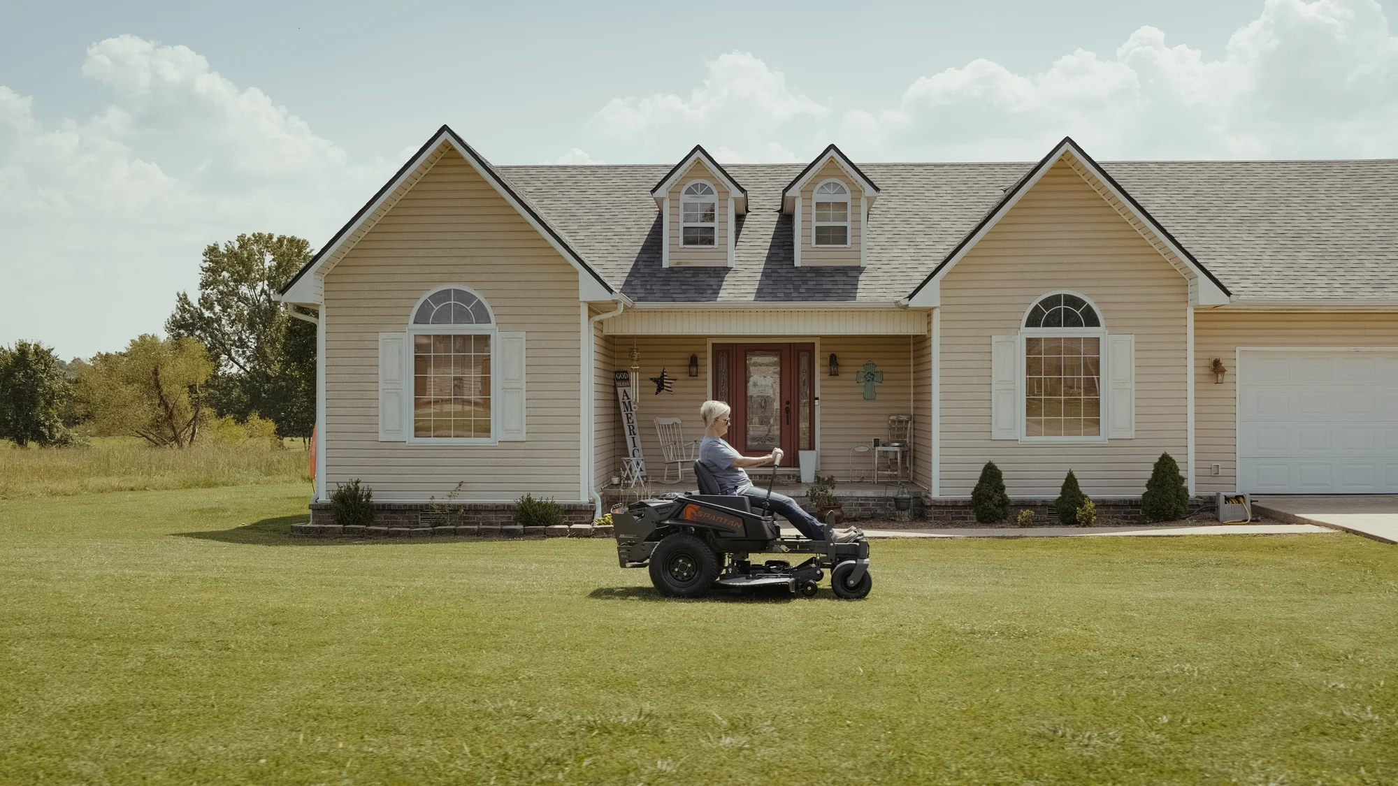 Spartan Shield Zero Turn Rider Szsh1K42722Se Side View Woman On Mower product image