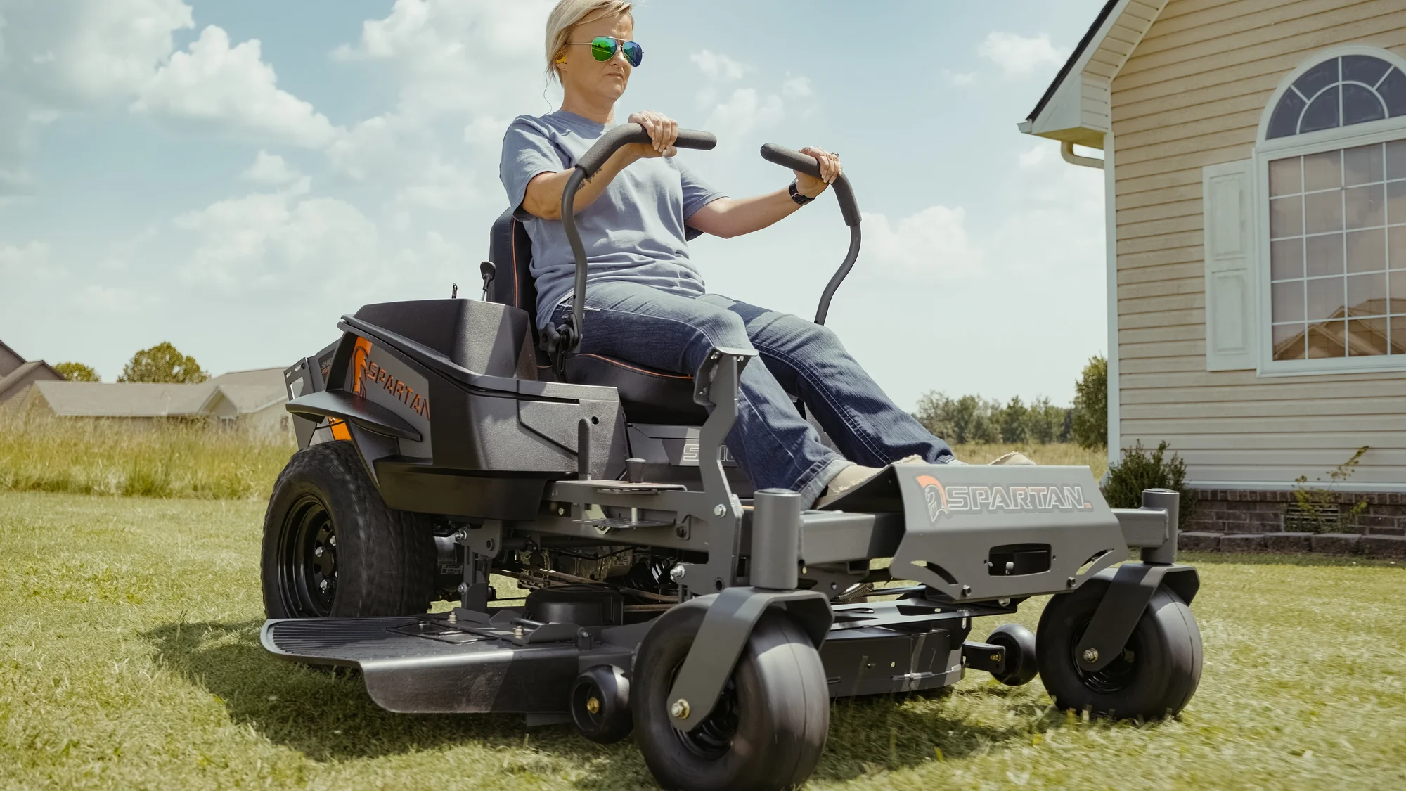 Spartan Shield Zero Turn Rider Szsh1K42722Se Woman On Mower House Side View Closeup product image