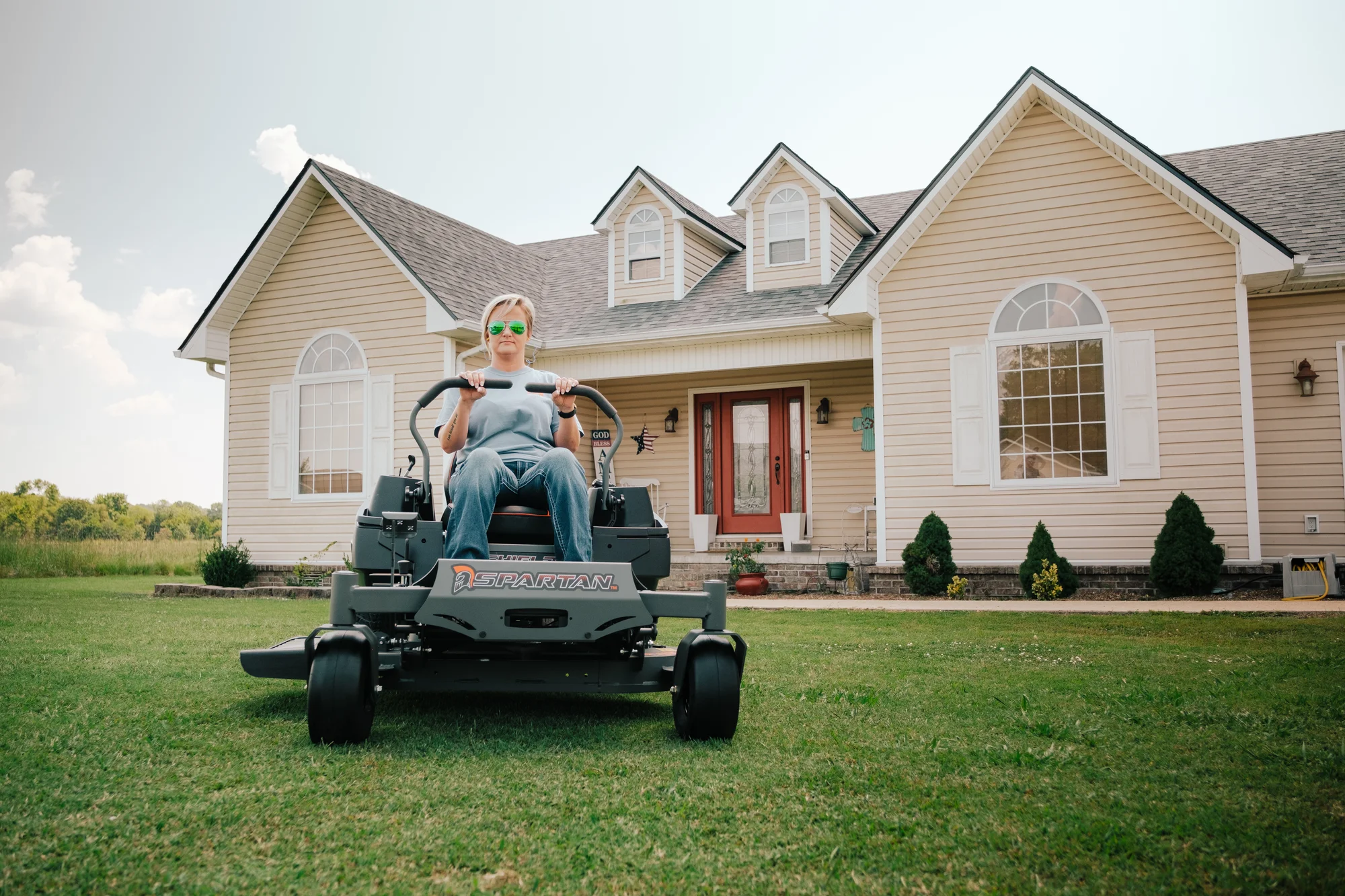 Spartan Shield Zero Turn Rider Szsh1K54691Kr Woman On Mower House Looking Forward product image