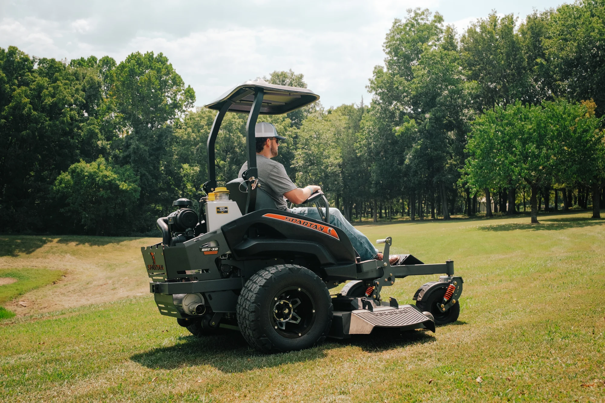 Spartan Srt Xd Zero Turn Rider Rssxd161999Ke Man On Mower Side View product image