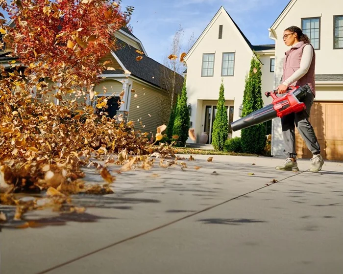 Toro 60V MAX Leaf Blower 51826 Toro 60V Max 750 Series Leaf Blower 51826 Woman Driveway Leaf Cleanup product image