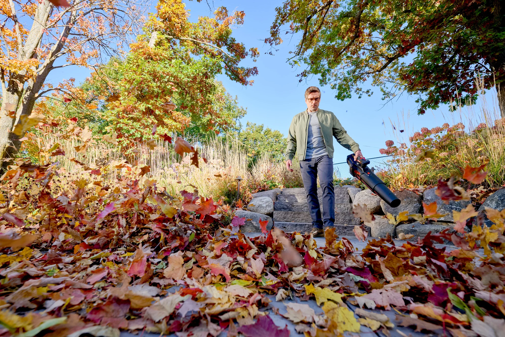 Toro 60V Max 900 Series Leaf Blower 51827 Blowing Leaf Pile Down Walkway product image