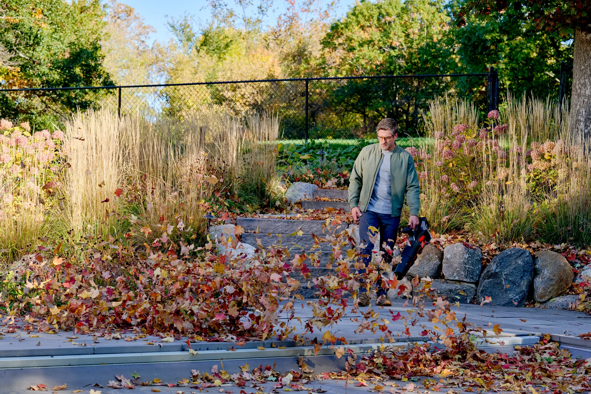 Toro 60V Max 900 Series Leaf Blower 51827 Clearing Leaves Across Driveway product image