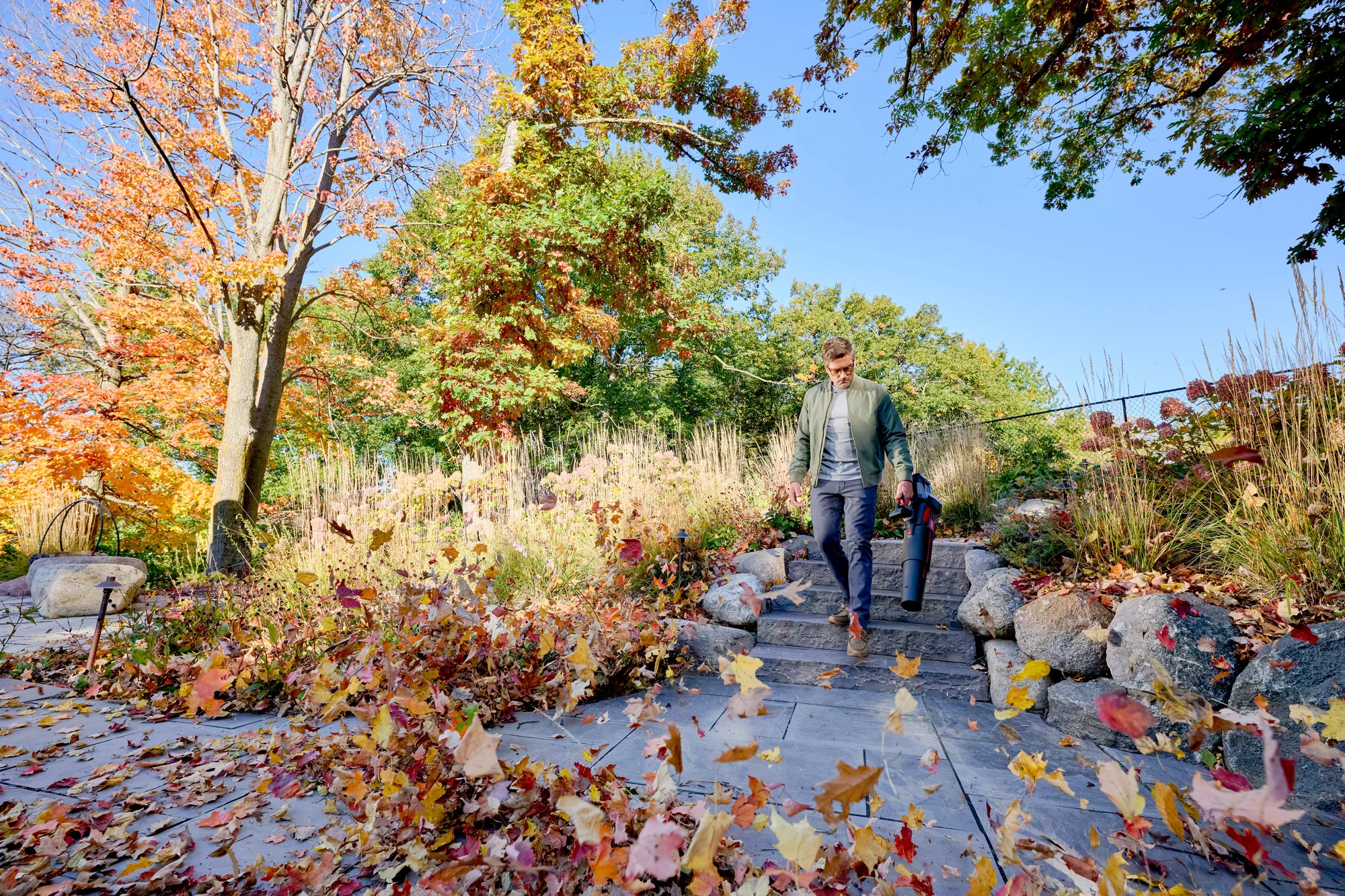 Toro 60V Max 900 Series Leaf Blower 51827 Clearing Leaves Along Walkway product image