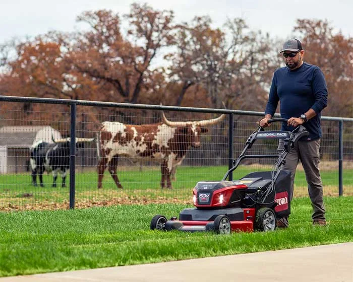 Toro 60v Max E Timemaster Series Walk Behind Lawn Mower 21493 Front View Right Cutting Grass