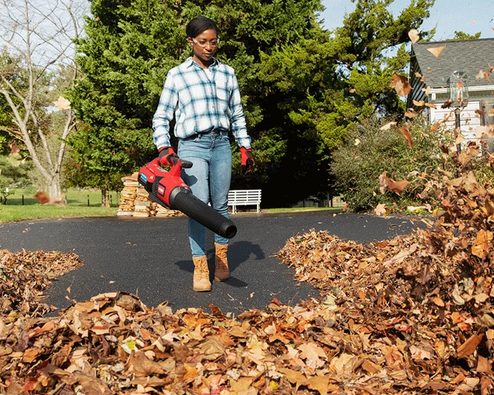 Toro 60V Max Leaf Blower 51822 Woman Blowing Leaves Front View product image