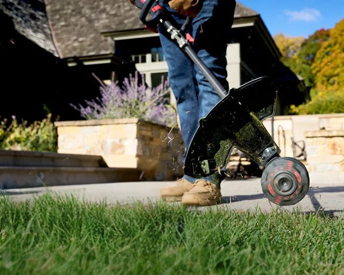 Toro 60V Max String Trimmer 51838 Toro 60V Max String Trimmer 51838 Cutting Grass Closeup product image