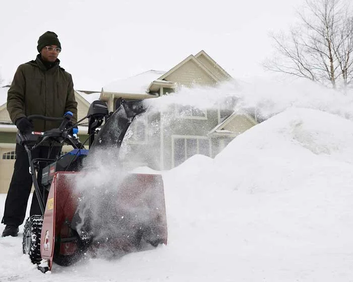 Toro 60v Snowmaster Series Single Stage Snow Blower 39914 Man Clearing Snow Closeup