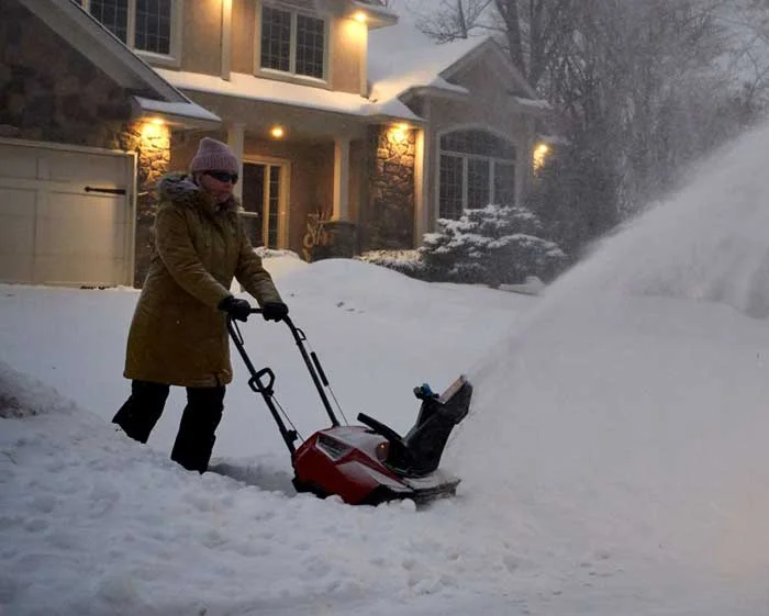 Toro Power Clear Series Single Stage Snow Blower 38475 Man Clearing Driveway product image