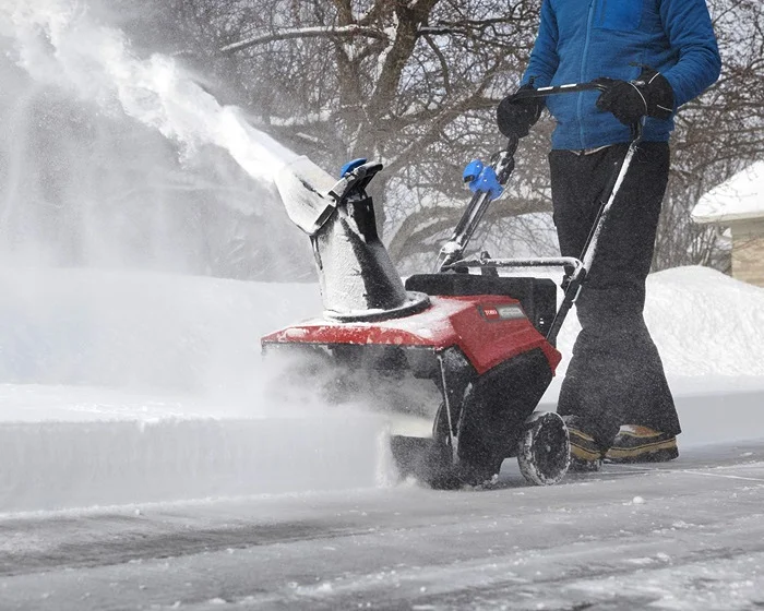 Toro Power Clear Series Single Stage Snow Blower 38753 Front View Right Clearing Driveway product image