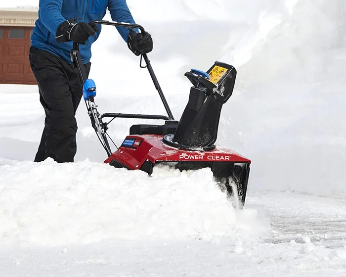 Toro Single Stage Power Clear 721 QZE Snow Blower 38756 Toro Power Clear Series Single Stage Snow Blower 38756 Front View Left Clearing Driveway product image