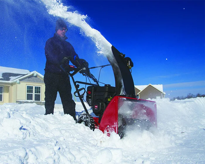 Toro Two Stage SnowMaster Snow Blower 824 QXE 36003 Toro Snowmaster Series Single Stage Snow Blower 36003 Front View Left Clearing Driveway product image