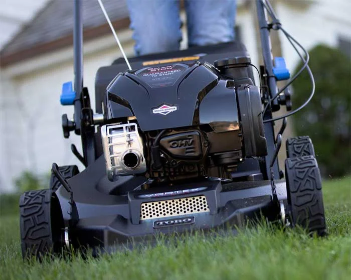 Toro Super Recycler Series Walk Behind Lawn Mower 21565 Front View Closeup Cutting Grass product image