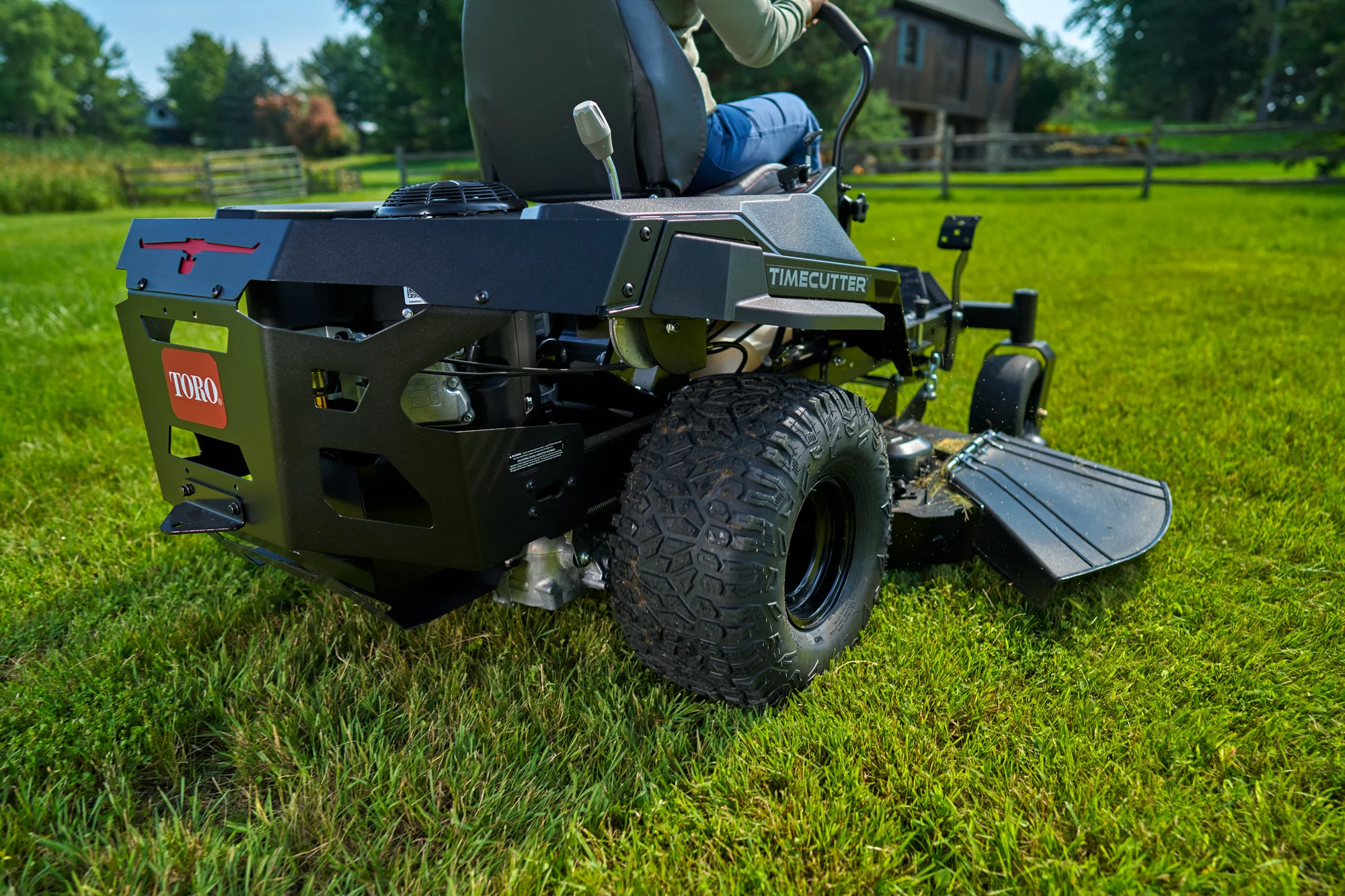 Toro Timecutter Max Havoc Myride Series Zero Turn Rider 77507 Woman Mowing Back View product image
