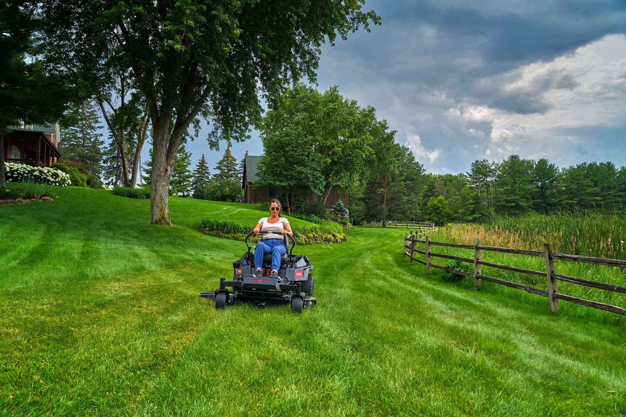 Toro Timecutter Max Havoc Myride Series Zero Turn Rider 77507 Woman Mowing By Fence product image