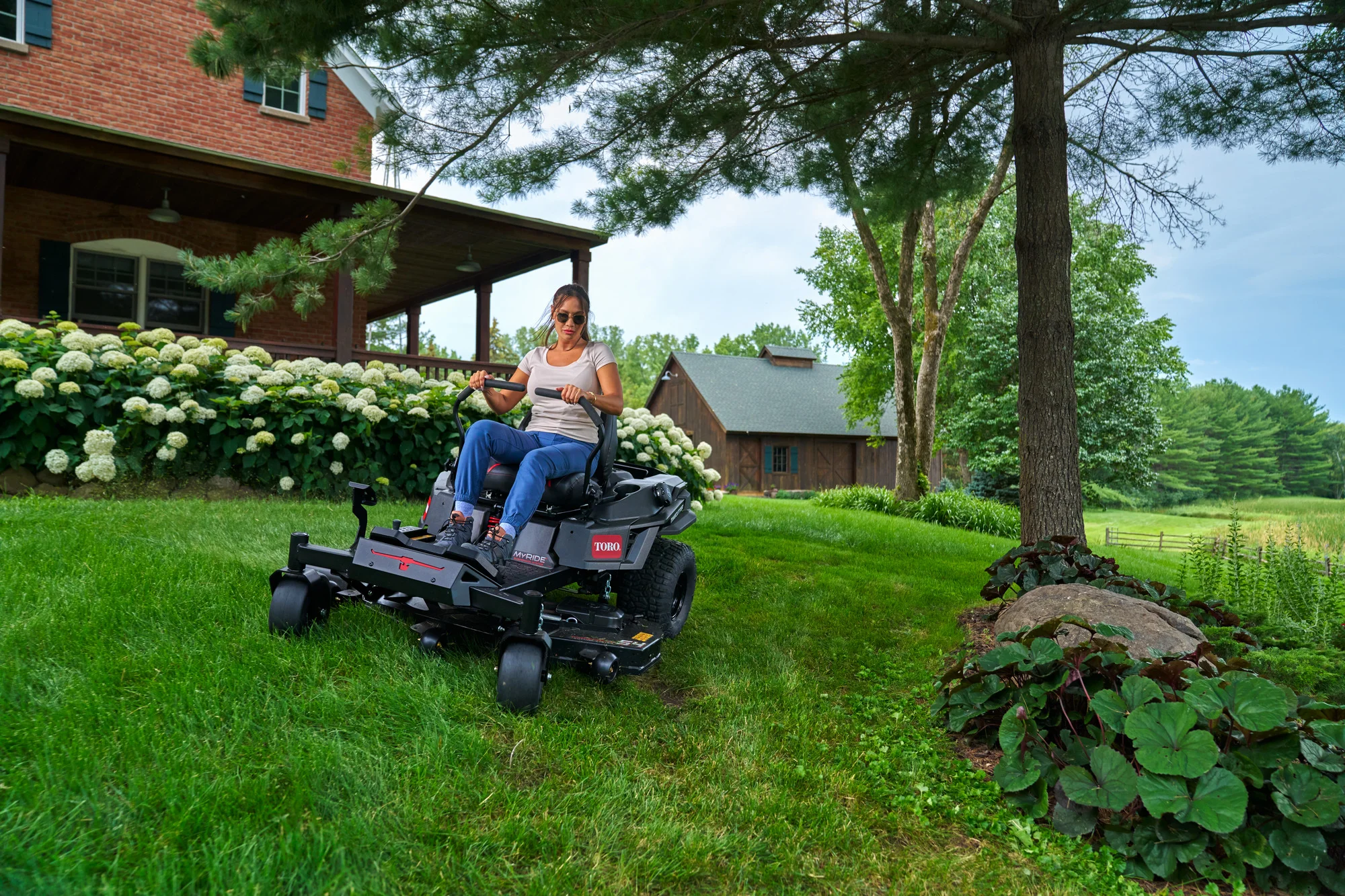 Toro Timecutter Max Havoc Myride Series Zero Turn Rider 77507 Woman Mowing By House product image