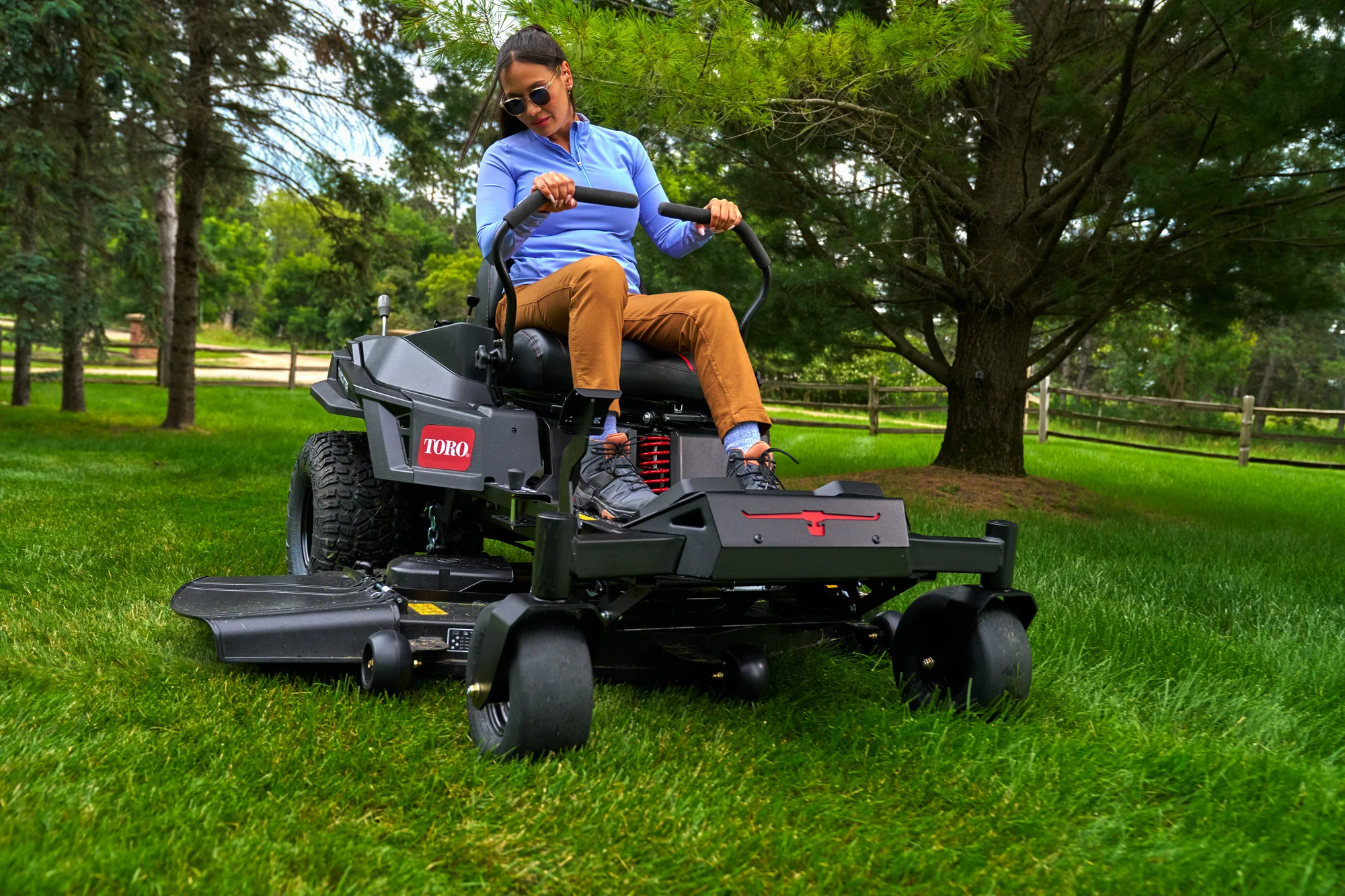 Toro Timecutter Max Havoc Myride Series Zero Turn Rider 77507 Woman Mowing By Tree product image